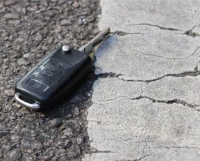 car key laying on the road